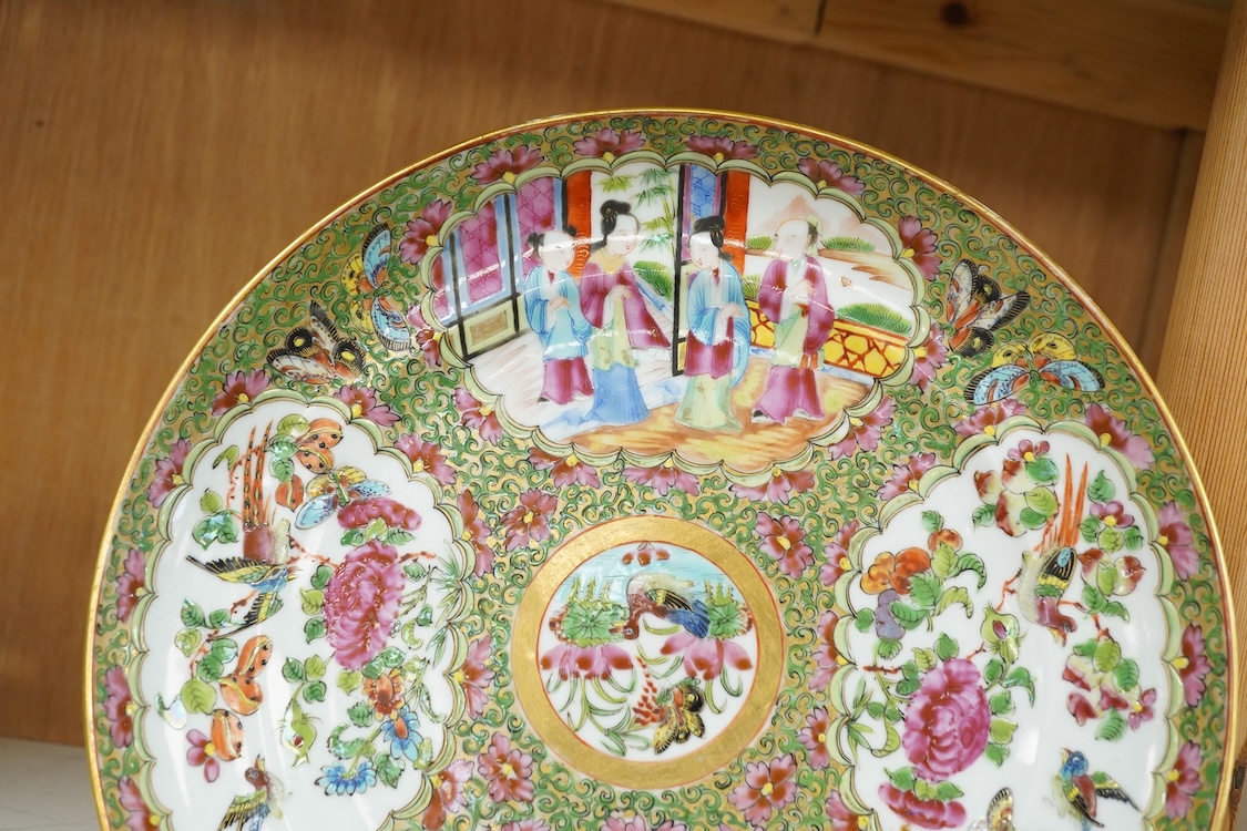 A 19th century Chinese famille rose porcelain dish enamelled with figures and flowers, 25cm in diameter